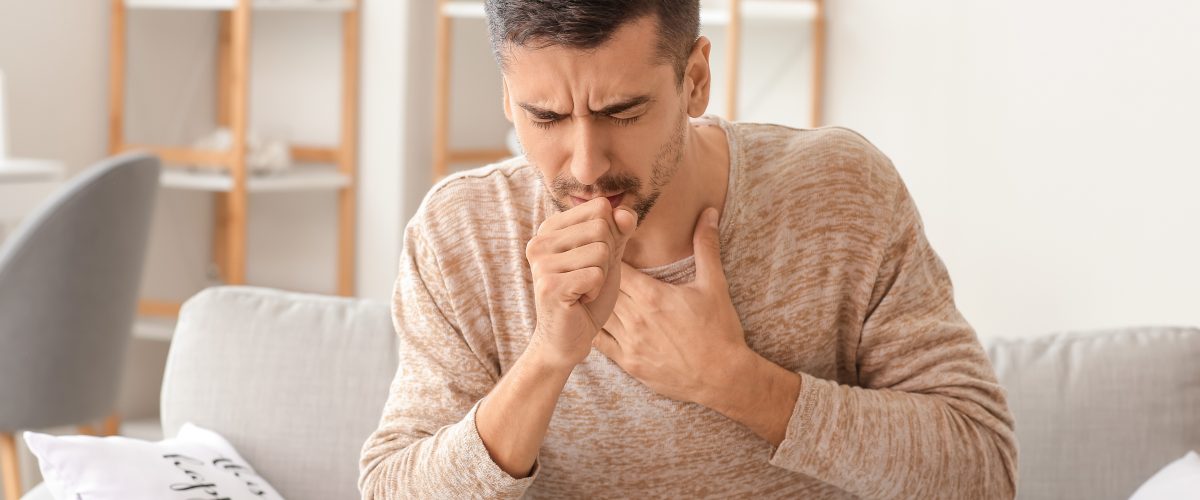 Coughing,Young,Man,At,Home