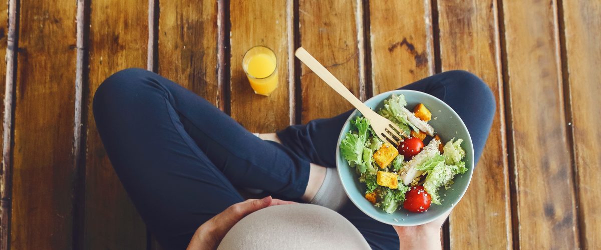 View,From,Above,Of,Pregnant,Woman,With,Fresh,Salad,Bowl
